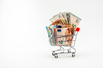 shopping cart full of euro bills with white background © MatéMoreno LH