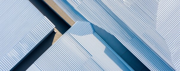 Abstract Geometric Roofing Aerial view of a modern building's silver corrugated metal roof, creating dynamic lines and shadows. Architecture, Minimalism