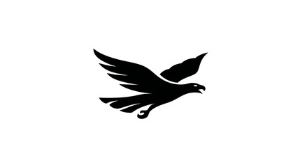 Fototapeta premium A black silhouette of an eagle in flight against a white background, wings spread