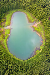 Obraz premium Drone view of Canario Lagoon. Lake formed by the crater of an old volcano in San Miguel island, Azores, Portugal. Scenic landscape. Ghost shape aerial illusion.