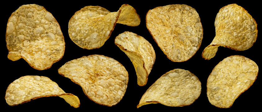 Natural potato chips isolated on black background, full depth of field