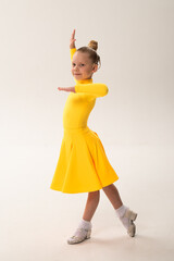 Close-up portrait of child with cochlear implant during dance practice. Hearing loss treatment, auditory rehabilitation, assistive medical technology, emotional adaptation, and inclusive healthcare