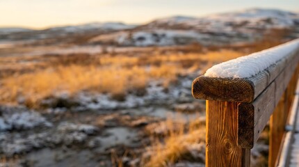 Snowy Wooden Railing at Golden Hour