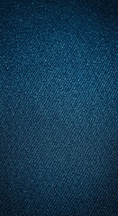 Close up image of rugged blue denim fabric texture showing the diagonal weave pattern and cotton fibers background surface, detail, empty, fabric