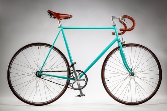 Hipster fixed-gear bike standing on white background
