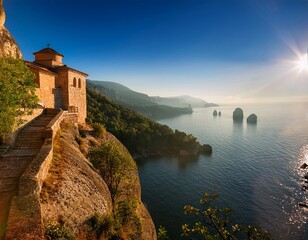 Fototapeta premium remote monastery cliffside trekking path serene landscape morning light dramatic stone walls