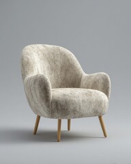 A single designer curved armchair upholstered in Cloud Dancer velvet fabric