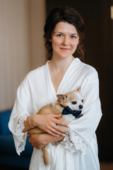 brunette bride in a tight wedding dress in a studio