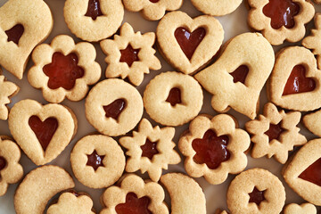 Traditonal Linzer Christmas cookies filled with strawberry marmalade