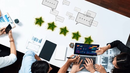 A modern team engages in a business meeting focused on strategic discussions and data analysis,...