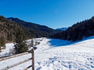 Around Spitzingsee in the Bavarian Alps. View from the Albert-Link chalet. Rote Valepp river and Valepper Almen at the foot of the Schwarzenkopf. Cross-country ski trail to the Blecksteinhaus
