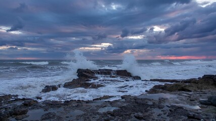 Waves surge and crash on a rocky peninsula