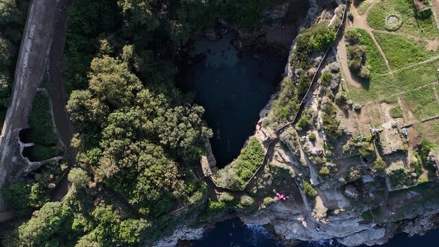 Aerial Drone Footage of Bagni della Regina Giovanna Ancient Roman Ruins and Natural Pool