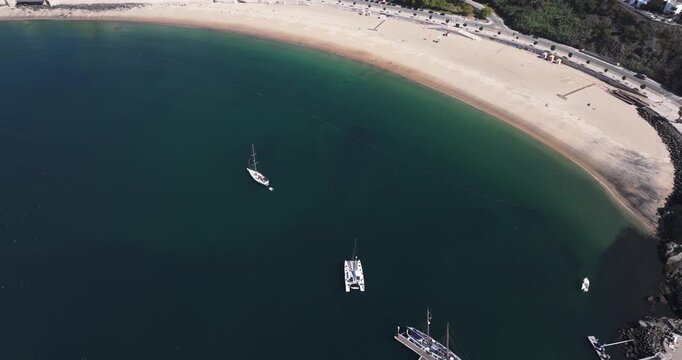 Aerial drone looking towards Sines curved beach and open bay