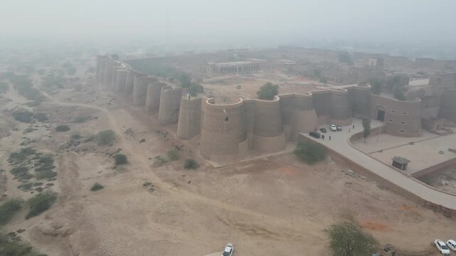 Drone orbiting around the iconic Derawar Fort from a high angle. Derawar fort is a tentative candidate of UNESCO World Heritage Site, located in Punjab, Pakistan. 4K Drone Video