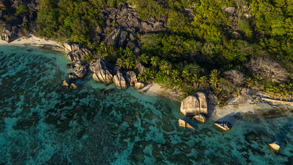 Drone photos of Seychelles beaches from above, showcasing white sand, crystal clear turquoise water, and tropical coastlines in a luxury island paradise setting © Andrei Tomas