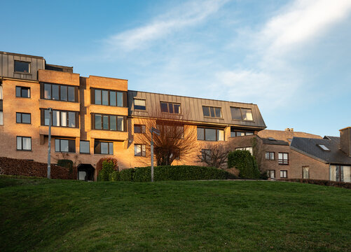 Residential buildings and student housing with green hill foreground
