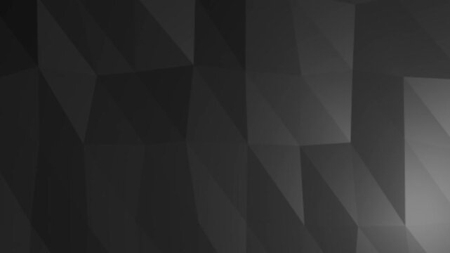 Abstract dark geometric surface with angular low-poly shapes