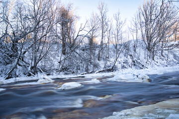 Icy River Rapids in Snowy Estonian Winter Landscape