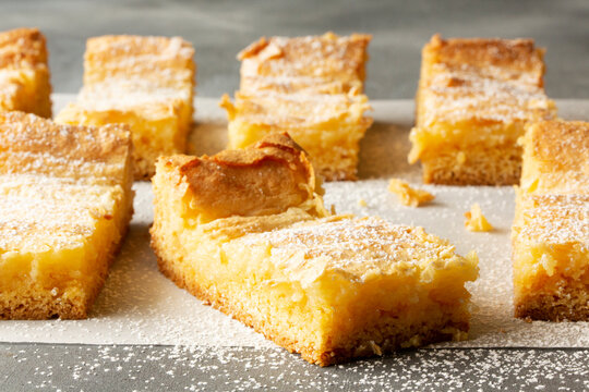 Gooey Butter Cake Bars dusted with powdered sugar