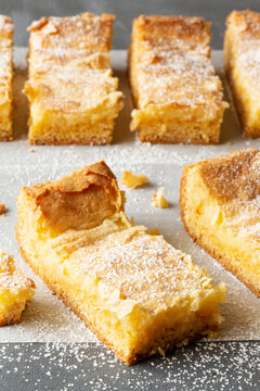 Gooey Butter Cake Bars dusted with powdered sugar