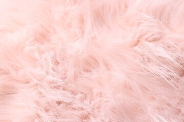Obraz premium Texture of pink fluffy fabric as background, top view