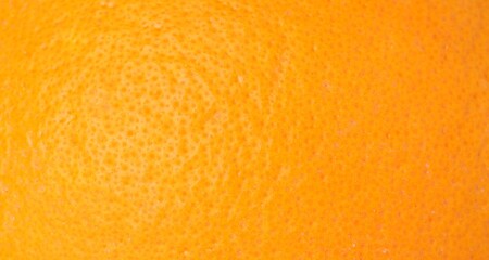 Fresh orange peel as background, macro view. Citrus fruit
