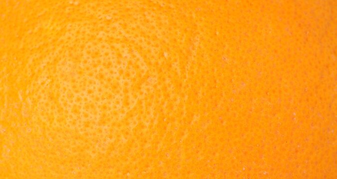 Fresh orange peel as background, macro view. Citrus fruit