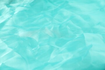Obraz premium Texture of light blue fabric as background, closeup