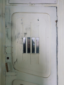 Crazy angry man behind bars, psycho, madman concept