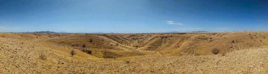 Dry landscape with sparse vegetation at Kuiseb Pass, Road C14 to Solitaire, Namibia, Naukluft National Park, Kuiseb Canyon.  