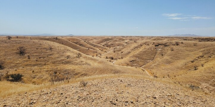 Dry landscape with sparse vegetation at Kuiseb Pass, Road C14 to Solitaire, Namibia, Naukluft National Park, Kuiseb Canyon.  