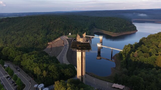 Aerial view of gileppe dam and reservoir at sunset