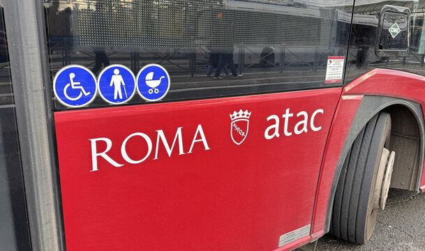 ATAC bus in Rome with accessibility symbols and SPQR city branding. Italy