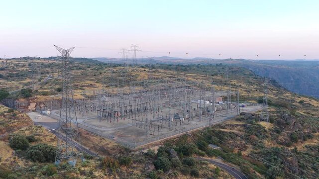AERIAL, Electrical substation with power pylons and power lines at a hydroelectric power plant (Aldeadavila).