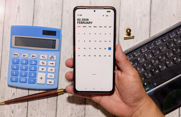 Minimalist white wooden block perpetual calendar displaying FEBRUARY 21