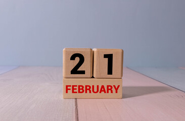 Minimalist white wooden block perpetual calendar displaying FEBRUARY 21