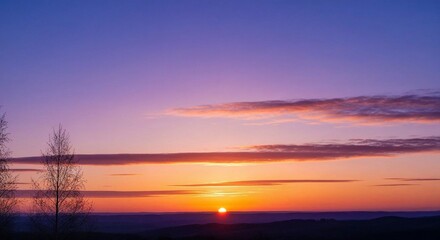 The spring equinox day - Sunset over horizon with colorful sky and silhouetted trees  