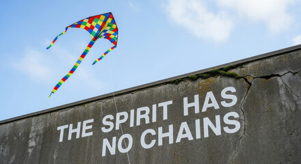 Freedom of spirit beyond the wall of remembrance