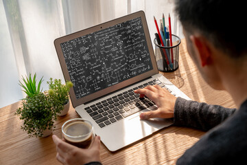 Mathematic equations and modish formula on computer screen showing concept of science and education