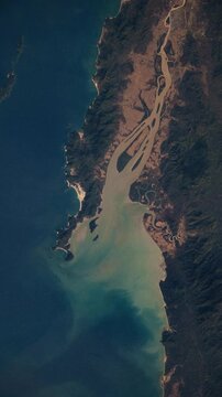 Vertical fly over of Tavoy River estuary in Myanmar, slow water movement animation based on Nasa imagery