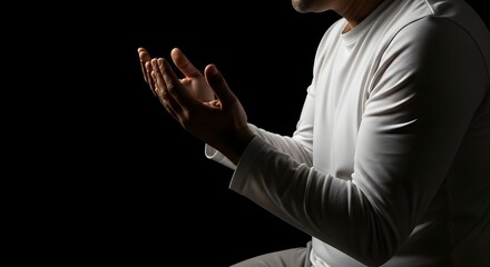 Devout Man Praying with Hands Open in a Gesture of Spiritual Connection