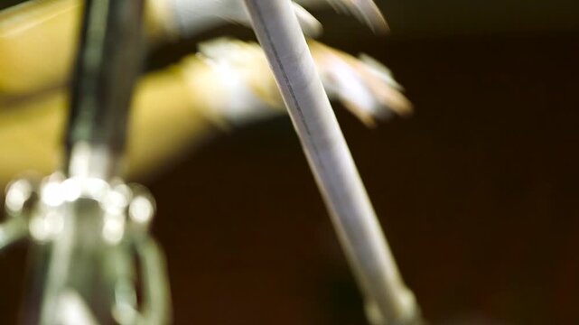 close up of gymnast hands on uneven bars