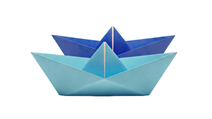 Two origami paper boats with starry patterns in blue and lighter blue
