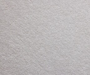 Fototapeta premium Texture of white wool fabric as background, top view