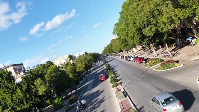 Aerial drone footage ascending above Paseo Montejo in M&eacute;rida, Yucat&aacute;n, while the camera performs a smooth 360-degree rotation.