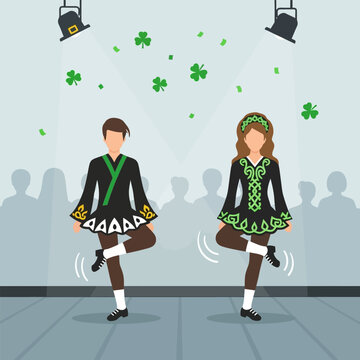 Irish dancers performing step dance on stage with spotlights and shamrocks