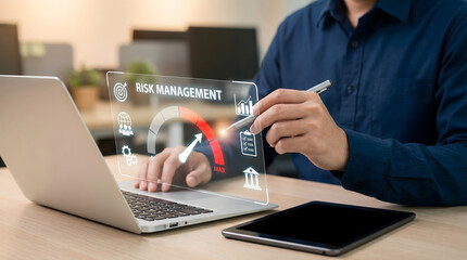 Professional man analyzes digital risk management data on a virtual screen in a modern office