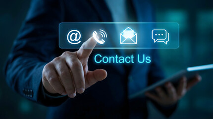 Business professional finger touches illuminated telephone icon on a digital contact us screen with 