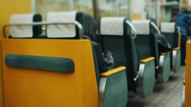 Row of empty seats inside a moving train